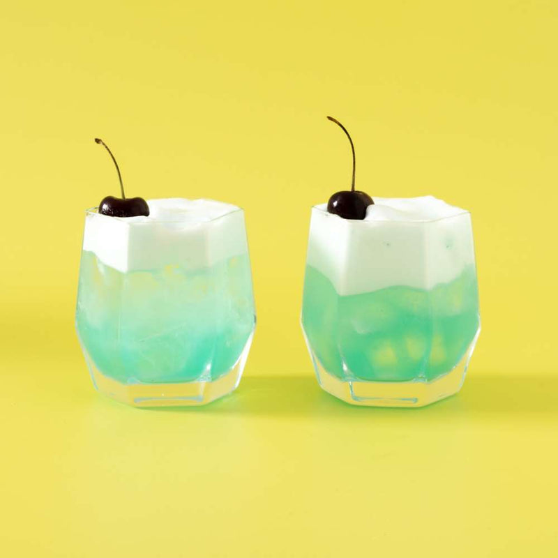 Blue-cocktail-with-cherry-tumbler-glasses 