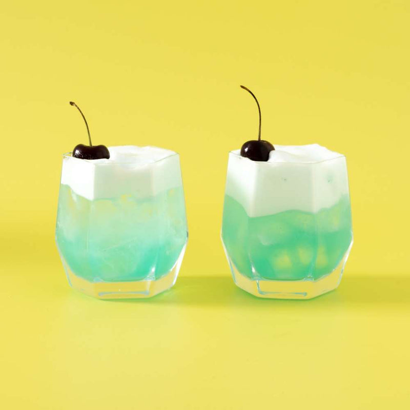 Blue-cocktail-with-cherry-tumbler-glasses